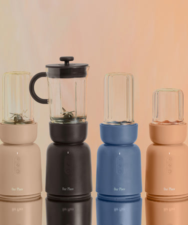 Set of four portable blenders on a gradient background