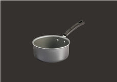 A silver saucepan with a black handle, viewed from a slight angle, is set against a plain black background.