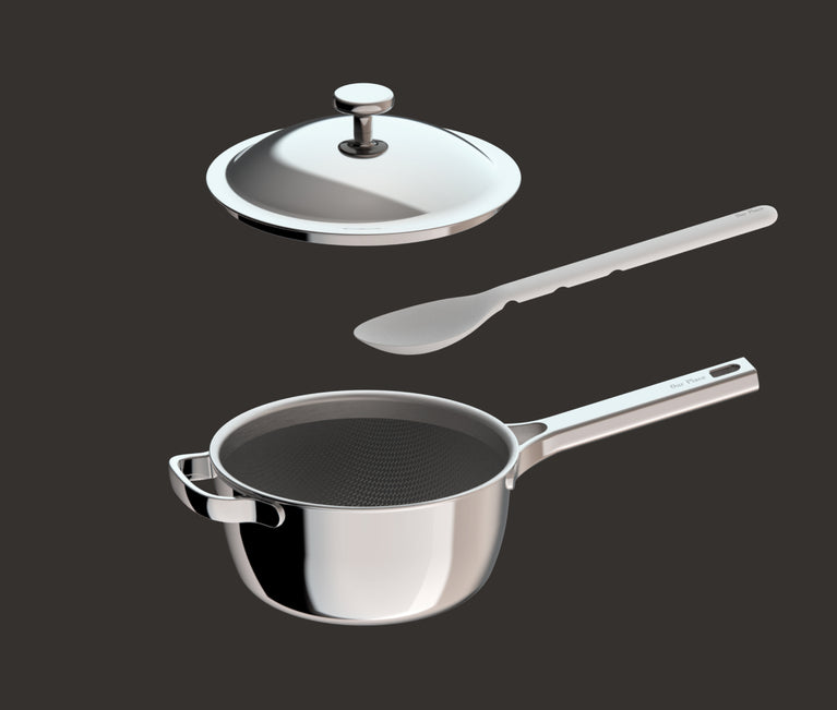 A stainless steel saucepan with a long handle, a matching lid, a mesh strainer insert, and a gray slotted spatula, all shown against a dark background.