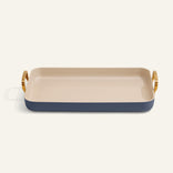 Rectangular ceramic tray with gold handles on a white background