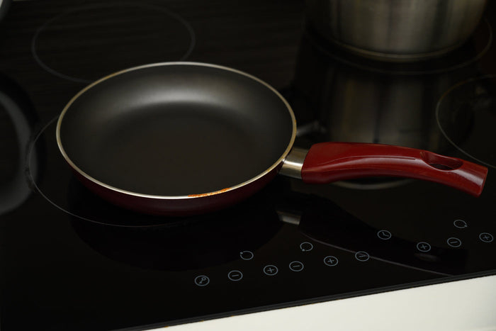 A nonstick pan on an induction stovetop