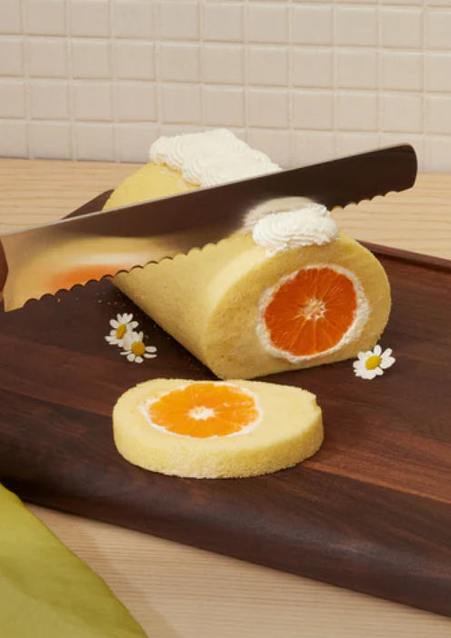 serrated knife cutting pastry