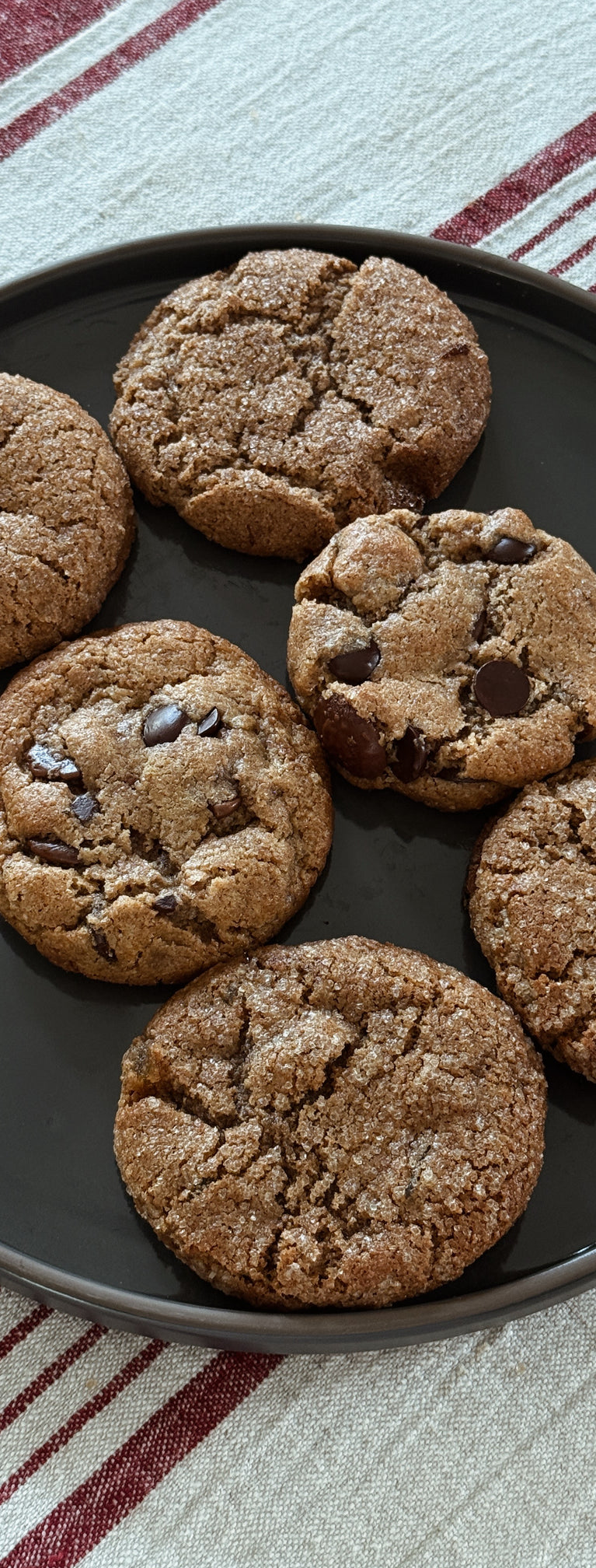 Plate of cookies on a striped tablecloth