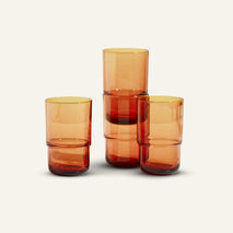 orange tall drinking glasses stacked