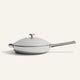 A Titanium Always Pan Pro 12.5″ 2.0 stainless steel frying pan with a matching lid and a long handle.