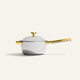 A white Titanium Perfect Pot Pro 3 qt. saucepot with a lid, featuring a gold-toned handle, side handle, and lid knob.