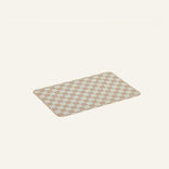 Checkered bath mat on a beige background