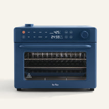 Blue oven with digital display on a white background