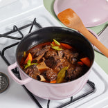 purple cast iron perfect pot braising meat on stovetop
