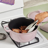 purple cast iron perfect pot searing meat on stovetop